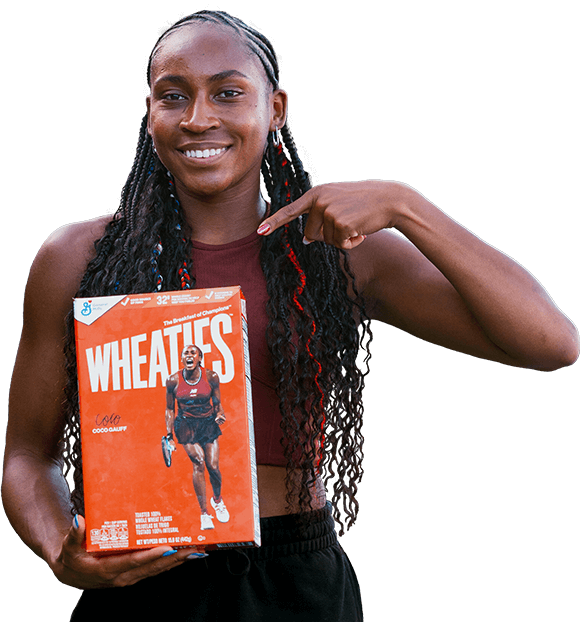 Coco Gauff pointing at a Wheaties box